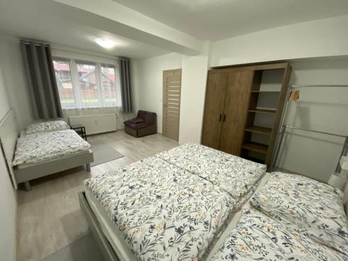 Postel nebo postele na pokoji v ubytování Apartmán Pod stráňou