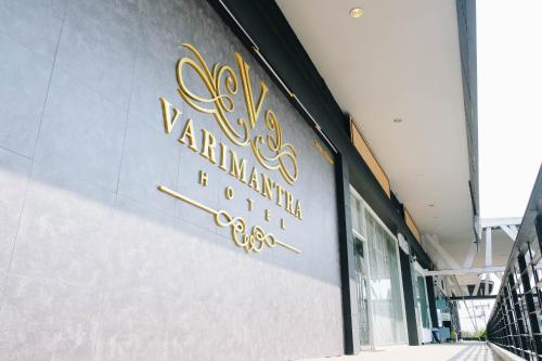 a sign on the side of a building at VARIMANTRA HOTEL in Nakhon Pathom