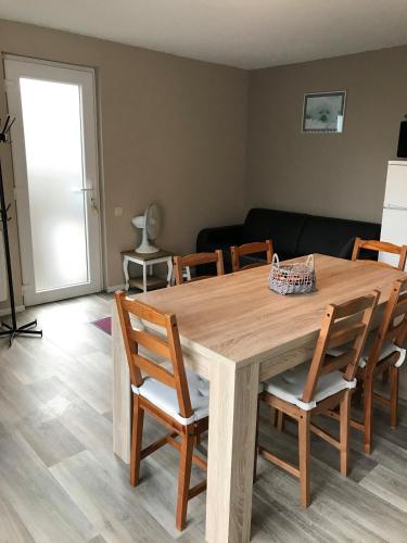 a dining room with a wooden table and chairs at Domaine "Les Hochets in Vresse-sur-Semois