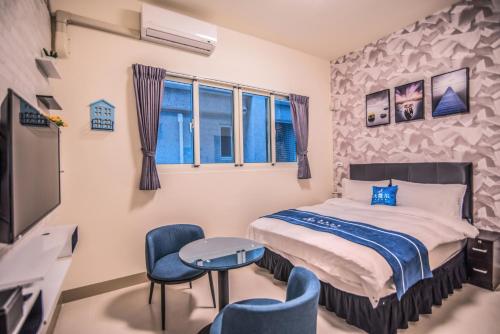Ein Bett oder Betten in einem Zimmer der Unterkunft Follow Me Travel Homestay