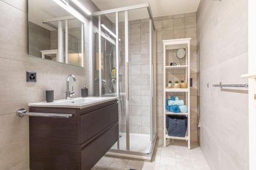 a bathroom with a sink and a shower at Seehüsli near Interlaken, Grindelwald and Lauterbrunnen in Därligen