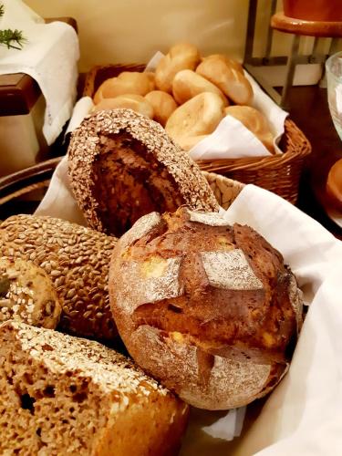 a tray of bread and pastries on a table at Bruggerhof in Fulpmes