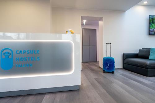 a lobby with a waiting room with a suitcase at Capsule Hostels Tallinn in Tallinn