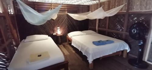 מיטה או מיטות בחדר ב-Chez Oliv