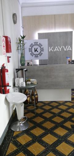 a kitchen with a counter and a sink in a room at Kayva in Trujillo