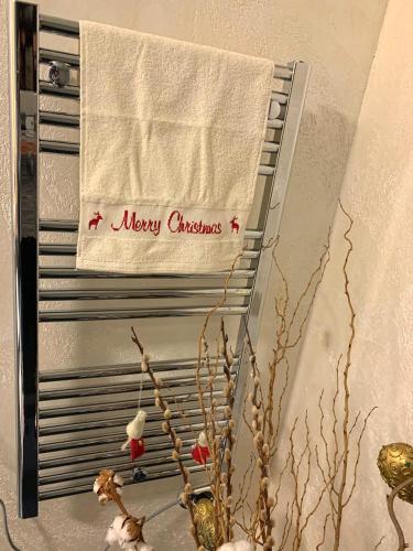 a towel hanging on a towel rack on a wall at Villa Kitzbühel in Kirchberg in Tirol