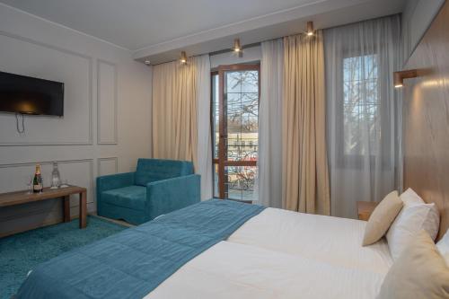 Postel nebo postele na pokoji v ubytování Boomerang Boutique Hotel