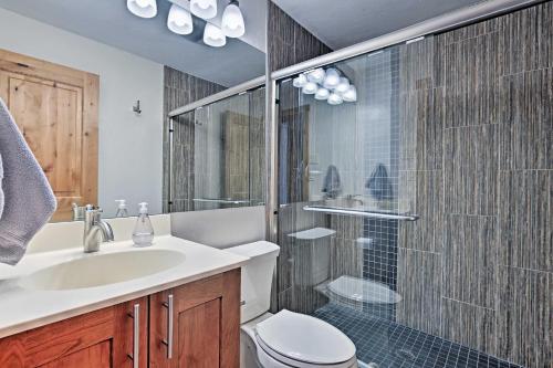 a bathroom with a toilet and a sink and a shower at Mtn-View Condo with Hot Tub Access in Dillon! in Dillon