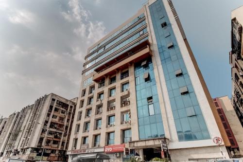 a tall building in a city with tall buildings at Hotel Pearl's BKC Inn- Near Trade Centre, Visa Consulate in Mumbai