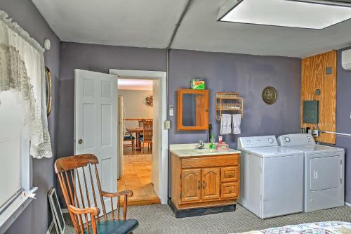a laundry room with a washer and dryer at Saratoga Springs Apt - Walk to Town and Race Track! in Saratoga Springs