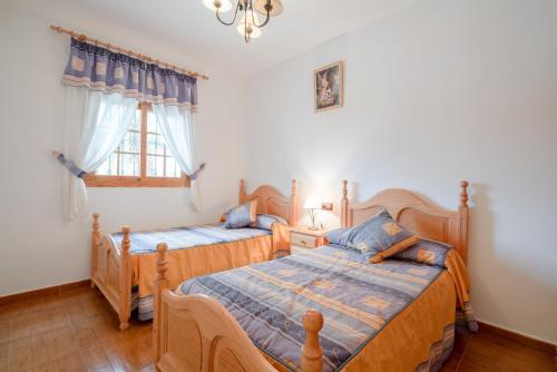 מיטה או מיטות בחדר ב-Cortijo la Encina