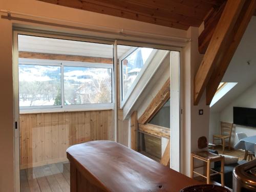 a room with a large window in a house at T2 Jausiers in Jausiers