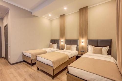 Ένα ή περισσότερα κρεβάτια σε δωμάτιο στο Sara Boutique Hotel