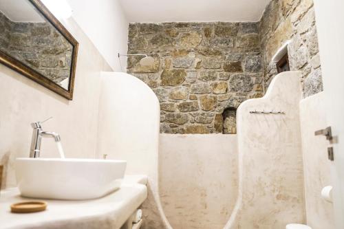 a bathroom with a sink and a shower at Casa Borealis in Naxos Chora