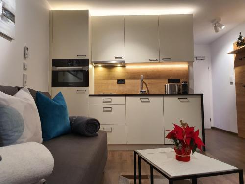 a living room with a couch and a table at Apartment Leontina in Kaprun