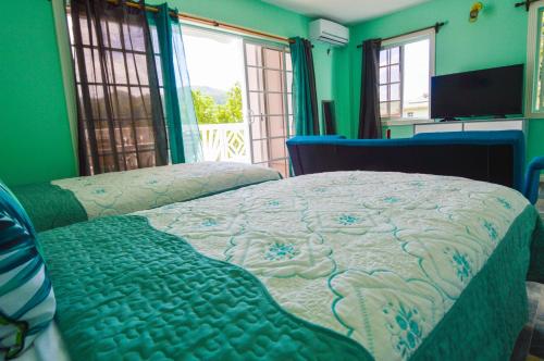 Ein Bett oder Betten in einem Zimmer der Unterkunft Sugarmon Villas