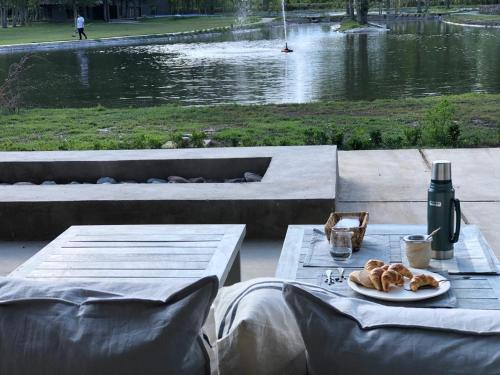 a table with a plate of food and a bottle of wine at Casa Septem in Villa Seca