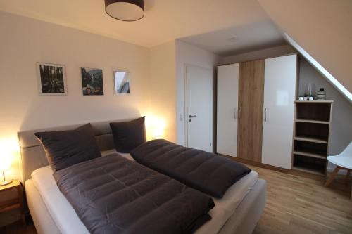 a living room with a large couch in a room at CASA STROBL in Landsberg am Lech