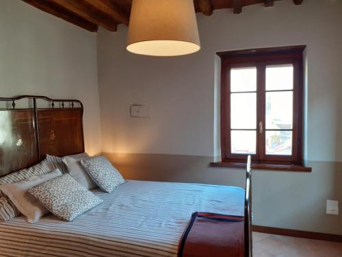 Giường trong phòng chung tại Casa Nostra Camaiore