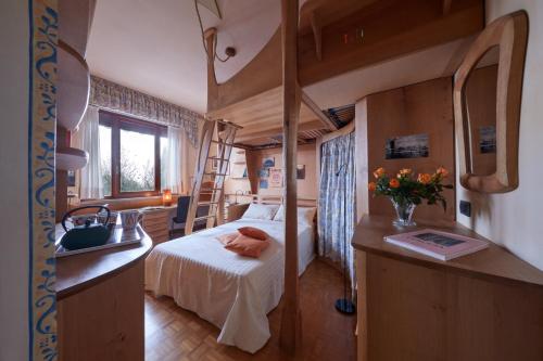 a bedroom with a bunk bed with a ladder at Le Balze Camere in Villa in Perugia
