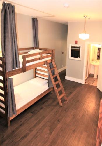 a bunk bed room with two bunk beds at The Clarence Park in Toronto