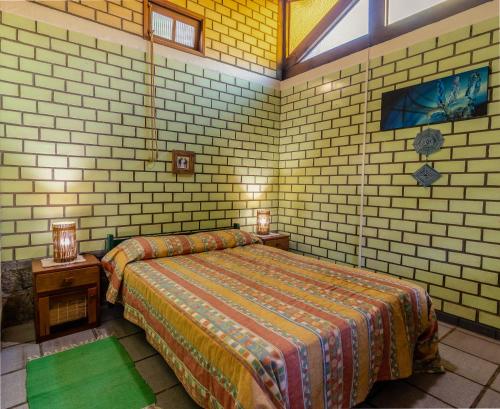 Ένα ή περισσότερα κρεβάτια σε δωμάτιο στο Punta Canoa cabanas