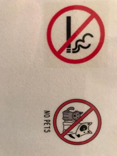 a sign that says no smoking and a no smokinghazard sign at TOP LOCATION - Klosters center - 130m distance to ski lift Parsenn Gotschnabahn and railway station Klosters Platz - direct connection to Davos in Klosters