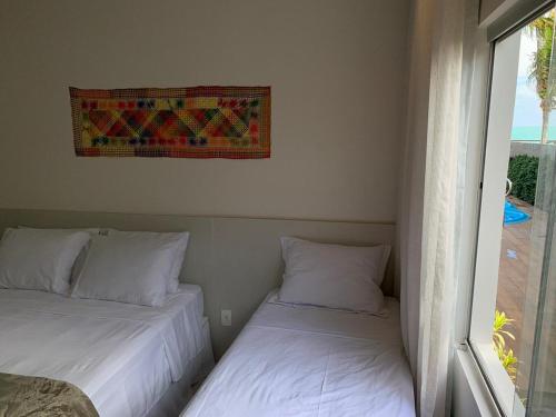 Postel nebo postele na pokoji v ubytování Pousada Ipioca Beach Village