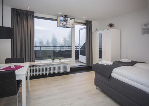 Ένα ή περισσότερα κρεβάτια σε δωμάτιο στο Appartement Brink Am Waltenberg 57-59