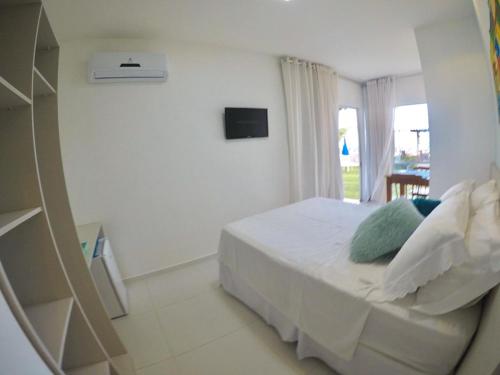 Postel nebo postele na pokoji v ubytování Pousada Ipioca Beach Village