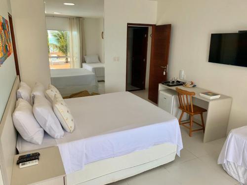 Postel nebo postele na pokoji v ubytování Pousada Ipioca Beach Village