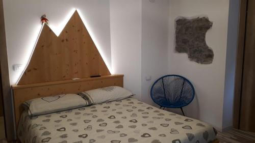 Postel nebo postele na pokoji v ubytování B&B Cuore Trentino