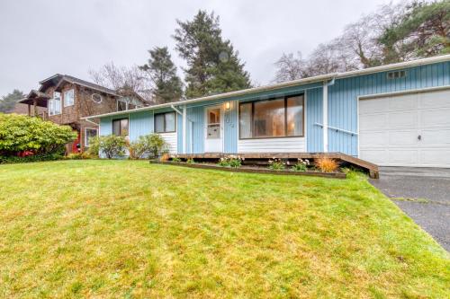 a blue house with a yard at Cottage on Hemlock Street in Cannon Beach