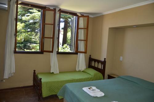 En eller flere senger på et rom på Posada Spa La Arabela