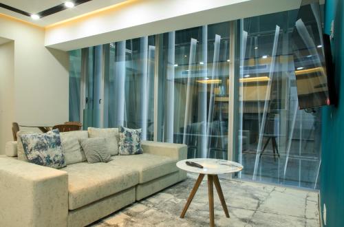 a living room with a couch and a table at Santa Fe Paradox Premier apt 2 bedrooms 4 guests 3403 in Mexico City