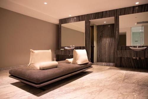 a bedroom with a bed with two mirrors and two sinks at Santa Fe Paradox Premier apt 2 bedrooms 4 guests 3403 in Mexico City
