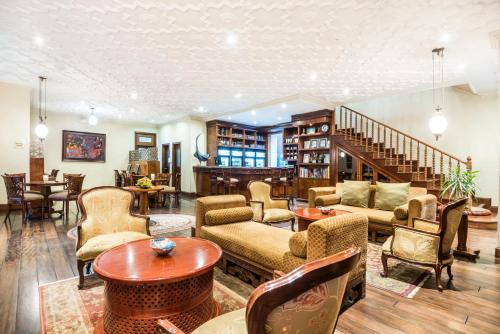 a living room filled with furniture and a staircase at Holiday Inn Express Quito by IHG in Quito