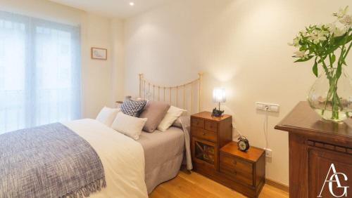 Ένα ή περισσότερα κρεβάτια σε δωμάτιο στο Apartamento Plaza de España