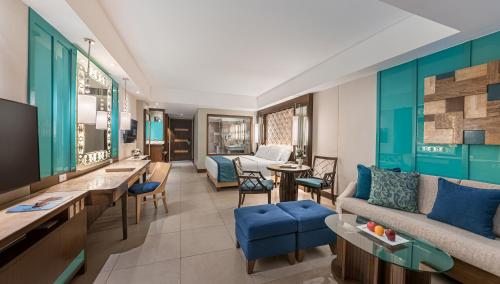 a living room with a couch and a table at Henann Resort Alona Beach in Panglao