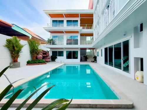 a swimming pool in the backyard of a house at Peranakan House in Phuket