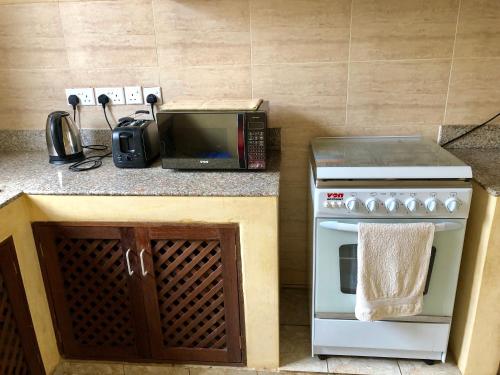 Küche/Küchenzeile in der Unterkunft Flametree Beach Homes