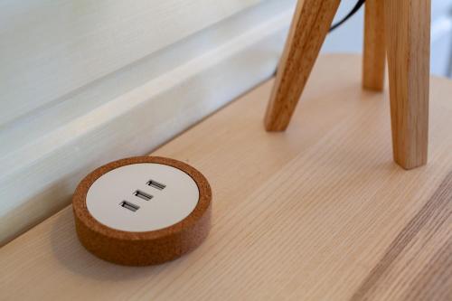 a small wooden box sitting on a wooden floor at Villa Vue Sauvage in La Trinité