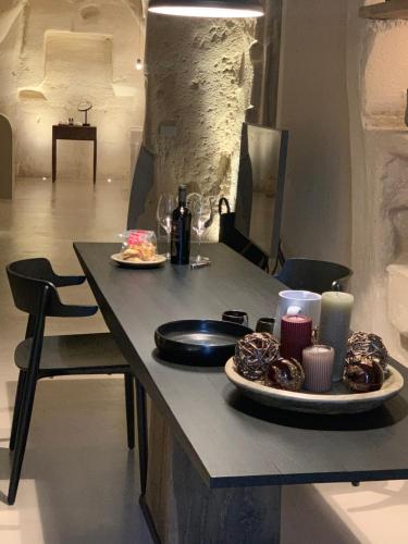 a table with two plates of donuts and candles at StageROOM02 - Matera in Matera
