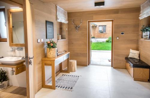 a bathroom with a sink and a mirror at Gruszowa Villa in Kalwaria Pacławska