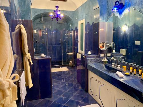 a bathroom with a sink and a shower at Villa Le Baste in Furore