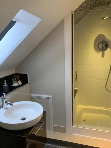 a bathroom with a sink and a shower at The Cottage Aberlour in Aberlour