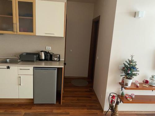 a kitchen with a christmas tree on the counter at Apartment at White Lavina Hotel in Bansko