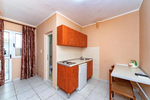 a kitchen with a sink and a counter top at Villa Glavanovic in Bar