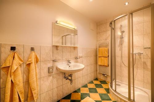 a bathroom with a sink and a shower at Appartementhaus Berger in Grossarl