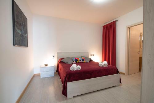 a bedroom with a bed with two towels on it at Agricola Domus in Barolo